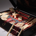 外銷象牙製益智遊戲<br/ ><b>Games box and contents</b><br />Lacquered wood, ivory, silk, brass<br />Canton; Qing dynasty, mid-19th c.<br /><em>Yi Zhi Tang</em> Collection 25-002