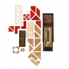 各種各樣的益智板<br/ ><b>Fifteen-piece tangram puzzles <i>(yizhi ban)</i></b><br />Wood, brass, painted lead in boxes<br />Shanghai; late Qing to Republic period<br /><em>Yi Zhi Tang</em> Collection 15-011, 15-003, 15-012, 15-010