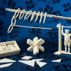 <b>外銷象牙製益智遊戲<br/ >Puzzles and acrobat toy (made for export)</b><br />Ivory, brass<br />Canton; Qing dynasty, mid-19th c.<br /><em>Yi Zhi Tang</em> Collection