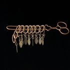 <b>銅絲製九連環<br/ >Nine linked rings / Chinese rings puzzle <i>(jiulianhuan)</i></b><br />Copper<br />Southern China; 20th c.<br />L. 15.0 cm<br /><em>Yi Zhi Tang</em> Collection 09-023