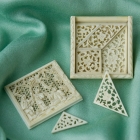 鏤空雕象牙七巧板及盒子<br/ ><b>Tangram puzzle <i>(qiqiao ban)</i></b><br />Carved ivory pieces in box<br />Canton; Qing dynasty, mid-19th c.<br />5.6 x 5.6 x 1.0 cm<br /><em>Yi Zhi Tang</em> Collection 26-006