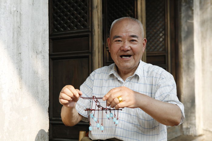 Ruan Genquan with nine linked rings wire puzzle