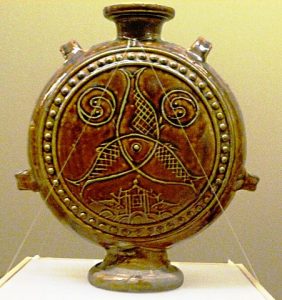 Brown-glazed jug with three-fish motif