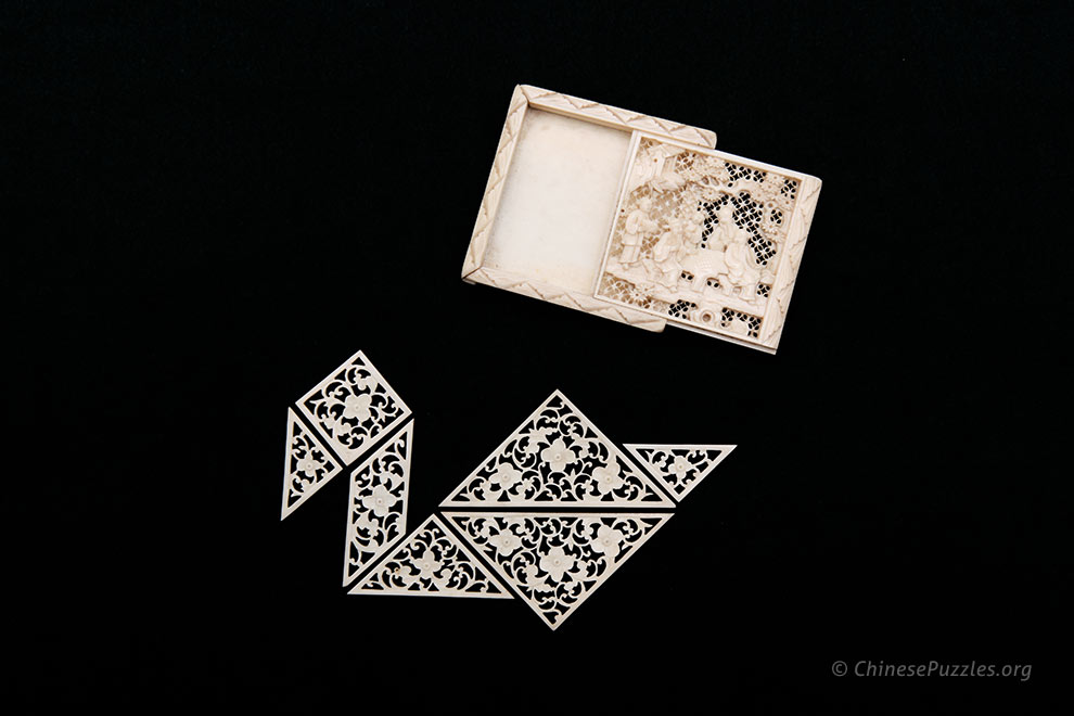 carved ivory tangram pieces